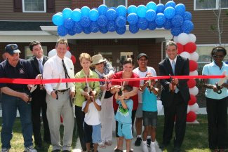 DHCR Assistant Commissioner Lynn Kopka (in green) joined members of the development team, local elected officials, and residents for the official opening of the Views at Rocky Glen. 